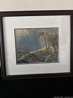 Front view of the framed artwork showing the cougar and kits in a natural setting.