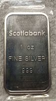 Front of silver bar showing Scotiabank logo, weight, and purity stamps.
