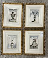 Overhead view of four framed fountain engravings arranged in a 2x2 grid on concrete floor