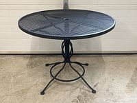 Front view showing full tabletop mesh pattern and umbrella hole at center