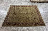 Full view of the rug laid flat on the floor showing overall pattern, color scheme, and rectangular shape.