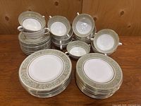 Overview of stacks of plates and cups arranged on table