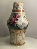 Front view of the Royal Nippon vase showing pink and white floral hand painted designs with gold detailing.