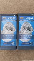 Two boxes of Active Air 3-ply premium ducting, showing product details and packaging.
