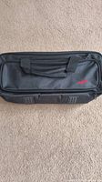 Top view of the black travel bag showing dual handles and zippered compartment with Mr Pawer logo in red.