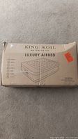 Box showing King Koil Luxury Airbed queen size packaging and branding.