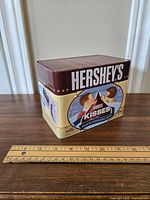 Front of Hershey's recipe tin with Kisses chocolate artwork, showing vintage promotional graphics.