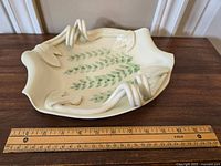 Top-down view of the signed Hilborn pottery tray with ruler for size reference.