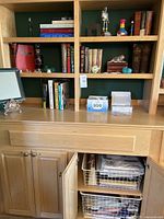 Overall view of built-in shelf with books and decorative items