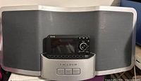 Delphi Sirius XM Radio Dock with speaker and docked radio unit visible