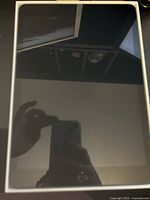 Front view of iPad turned off, showing touchscreen and Home button.