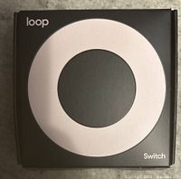 Front of Loop Switch earplugs box showing brand and product name with circular design.