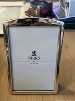 Front view of Birks sterling silver picture frame with 4x6 inch placeholder and logo visible