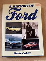 Front cover of the book showing title 'A History of Ford' and images of various Ford vehicles including classic and modern models.