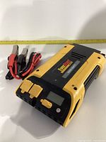 Top/front view of EverStart 1000 watt power inverter showing dual AC outlets, digital display, power button and connection ports.