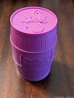 Purple plastic Barrel of Monkeys container with embossed monkey and text.