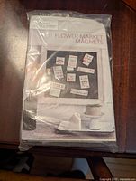 Unopened DIY Flower Market magnets kit with visible branding and magnet examples on packaging.