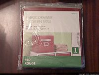 Red fabric cube drawer organizer in original packaging showing size and labeling.