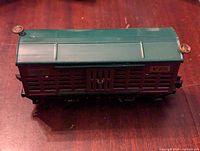 Top view of the Lionel Lines train car No. 806 showing the green roof and brown slatted side design.