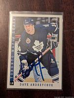 Front side of signed Dave Andreychuk 1993-94 hockey card in Toronto Maple Leafs uniform, showing autograph.