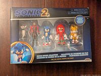 Front of unopened package showing four figures arranged inside with Sonic the Hedgehog 2 logo and details about articulation.