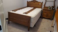 Full view of assembled bed frame with mattress and boxspring in room