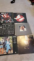Vinyl LP records including Rocky IV, Ghostbusters, Rocky / The Guess Who, ABBA Greatest Hits, ABBA Super Trouper