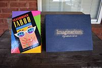 Photo showing Celebrity Taboo boxed game and Imaginarium Signature Series checkers box next to it on a brick surface.
