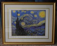 Full view of framed print of Van Gogh's Starry Night showing gold-tone wood frame and double matting.
