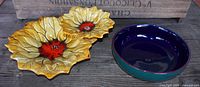 Photo shows the vintage Marcia Pottery sunflower chip and dip server platter with two connected sunflower-shaped dishes, yellow and orange glazed.
