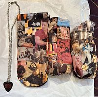 Necklace with black guitar pick pendant labeled 'Elvis' on silver chain and three pairs of socks featuring collaged images of Elvis Presley in various poses and outfits.