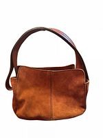 Front view of brown suede purse showing entire shape, material and strap