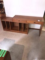 Overview of both desk and cabinet assembled side by side showing adjustable configuration