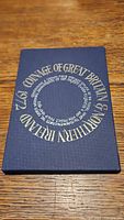 Blue presentation box with '1972 Coinage of Great Britain Northern Ireland' text in circular pattern