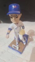 Front view of Troy Tulowitzki bobblehead in Blue Jays uniform, showing details of face, helmet with logo, glove and base.