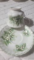 Royal Albert Bone China cup and saucer featuring Lily of the Valley flower design for May, part of the Flower of the Month series.
