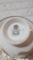 Bottom of cup showing Paragon brand mark and 'By Appointment to Her Majesty The Queen' mark, indicating origin in England and authenticity.