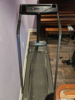 Overall front view of the Weslo Cadence 860 treadmill showing the walking belt, frame, and handrails