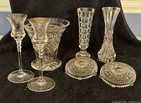 Photo of 3 crystal vases - 2 shorter with gold rim, 1 tall with checkered pattern