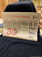 Folded front page of The Toronto Telegram final edition with headline announcing the last day of publication.