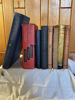 All 8 vintage books shown in a standing position with spines visible including 'Canada' by Leacock, 'TRIO' by Frank G. Slaughter and others.