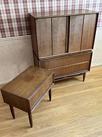 Wardrobe hutch and night table side by side showing overall shape and finish