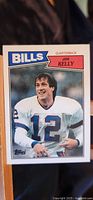 Front of 1987 Topps Jim Kelly rookie card showing player image and team name