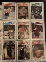 Photo of nine hockey cards featuring Mario Lemieux, Bob Joyce, Joe Quenneville, Tony McKegney, Stephane Richer, Mark Howe, Brent Sutter, Gilles Meloche, and Jimmy Carson.