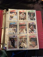 Page showing Bob Probert, Brendan Shanahan, and other cards in plastic sheet.