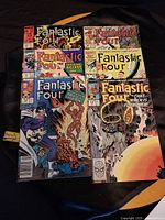 Six Fantastic Four comics spread out for viewing, showcasing cover art and condition.