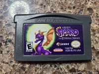 Close-up photo of a Game Boy Advance cartridge for the game 'The Legend of Spyro: The Eternal Night', showing label and condition.
