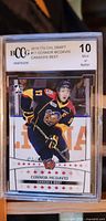 Front of 2015 ITG CHL Draft Connor McDavid card graded 10 Mint or Better by BCCG showing McDavid in Canada West Tigers jersey.