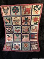Full view of the farmhouse patchwork quilt showing all 20 squares and borders.