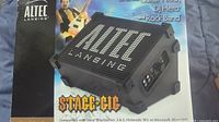Photo of Altec Lansing Stage-Eig portable amplified speaker from front angle showing logo and speaker grille.